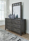 Montillan King Panel Bed with Mirrored Dresser, Chest and Nightstand